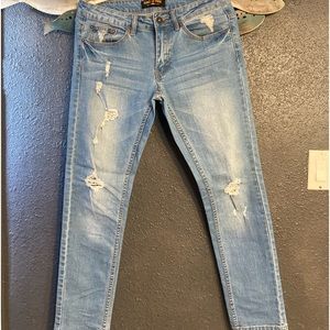 Ring of fire distressed jeans.